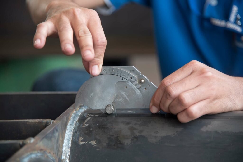 Photo of a technician performing a weld inspection